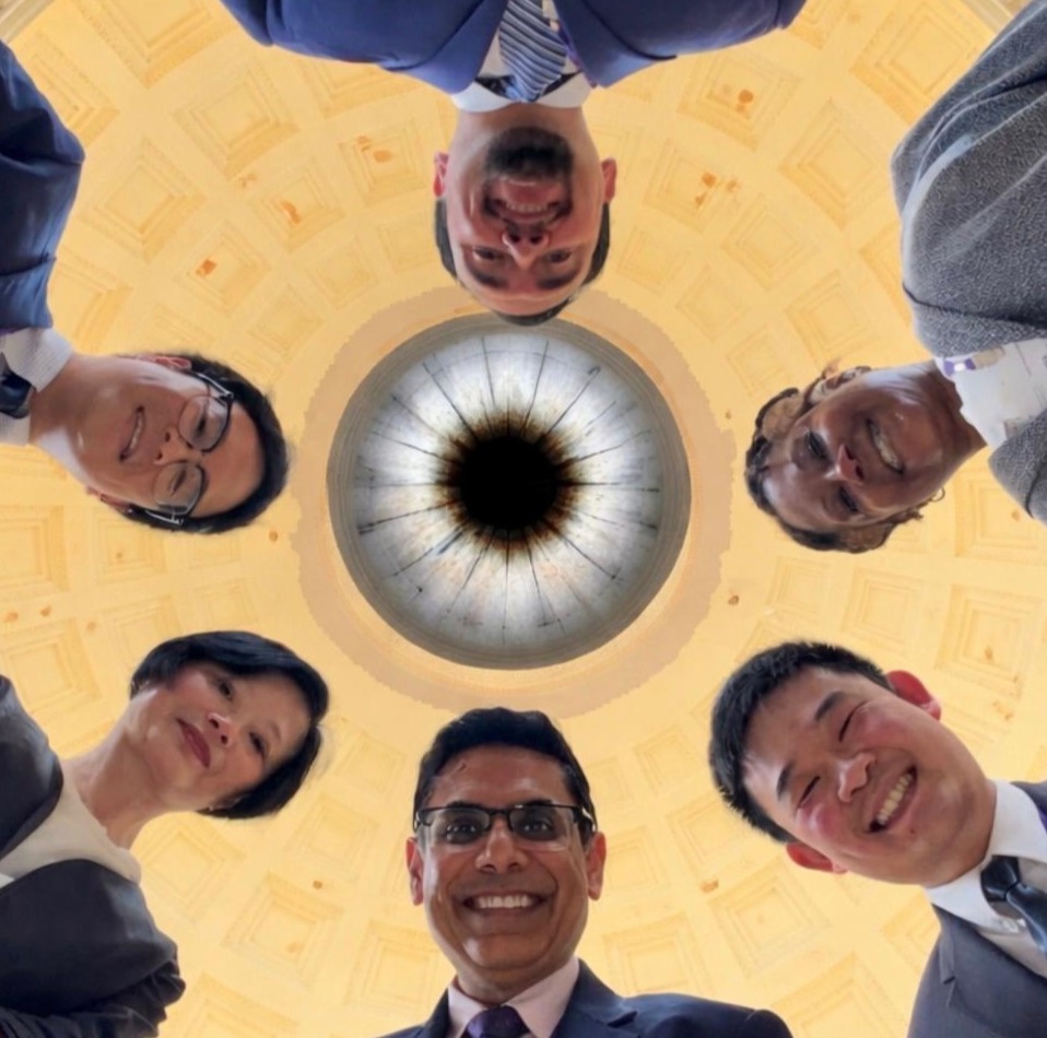 6 members looking down the camera